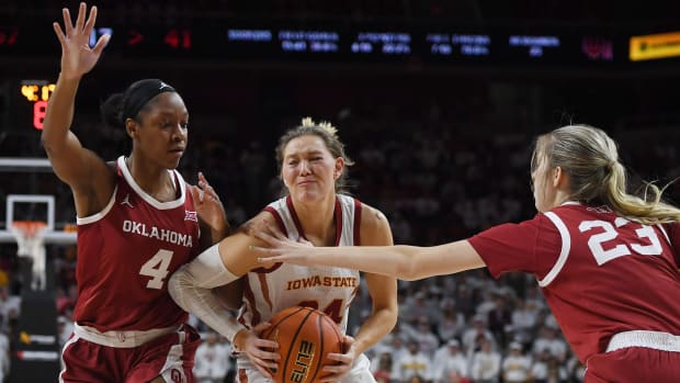 Iowa State Cyclones guard Ashley Joens (24) drives to the basket between Oklahoma Sooners guard Kennady Tucker (4) and Oklahoma Sooners guard/forward Skylar Vann (24) during the third quarter at Hilton Coliseum, Saturday, Feb. 19, 2022, in Ames, Iowa.